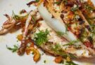 Squid stuffed with breadcrumbs, dried fruits, pine nuts, capers and fennel